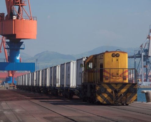 Containers on a rail track in a port